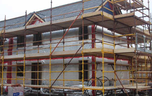 Timber frame home under construction.